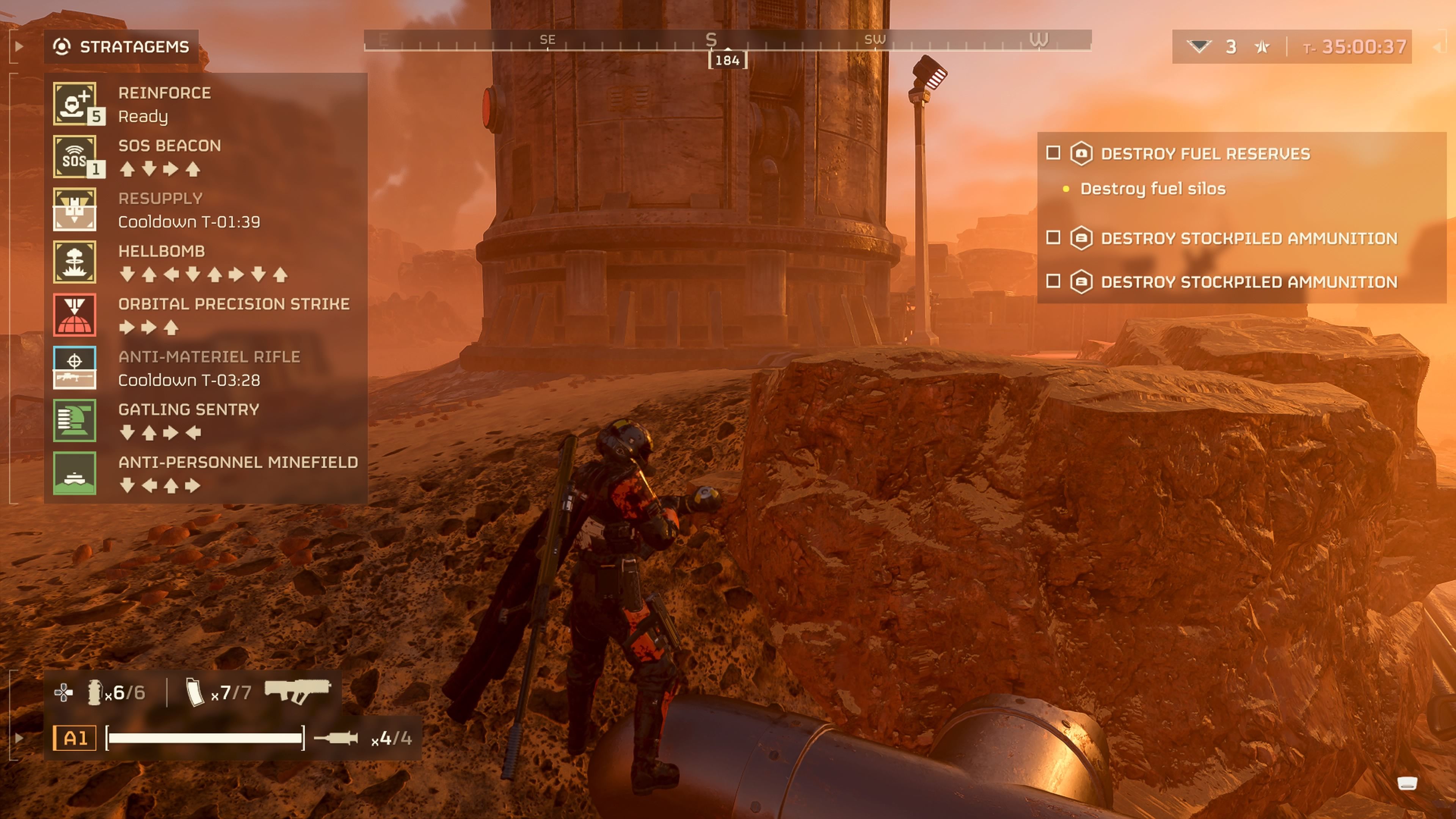 Player character accessing their stratagem menu near a Fuel Silo and showing the standard ones alongside a Hellbomb stratagem in Helldivers 2