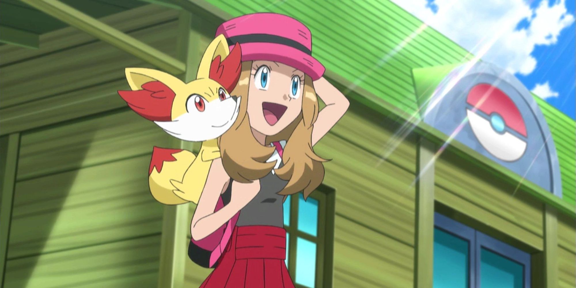 Pokemon anime Serena in piedi fuori dal Centro Pokemon con Fennekin sulla schiena