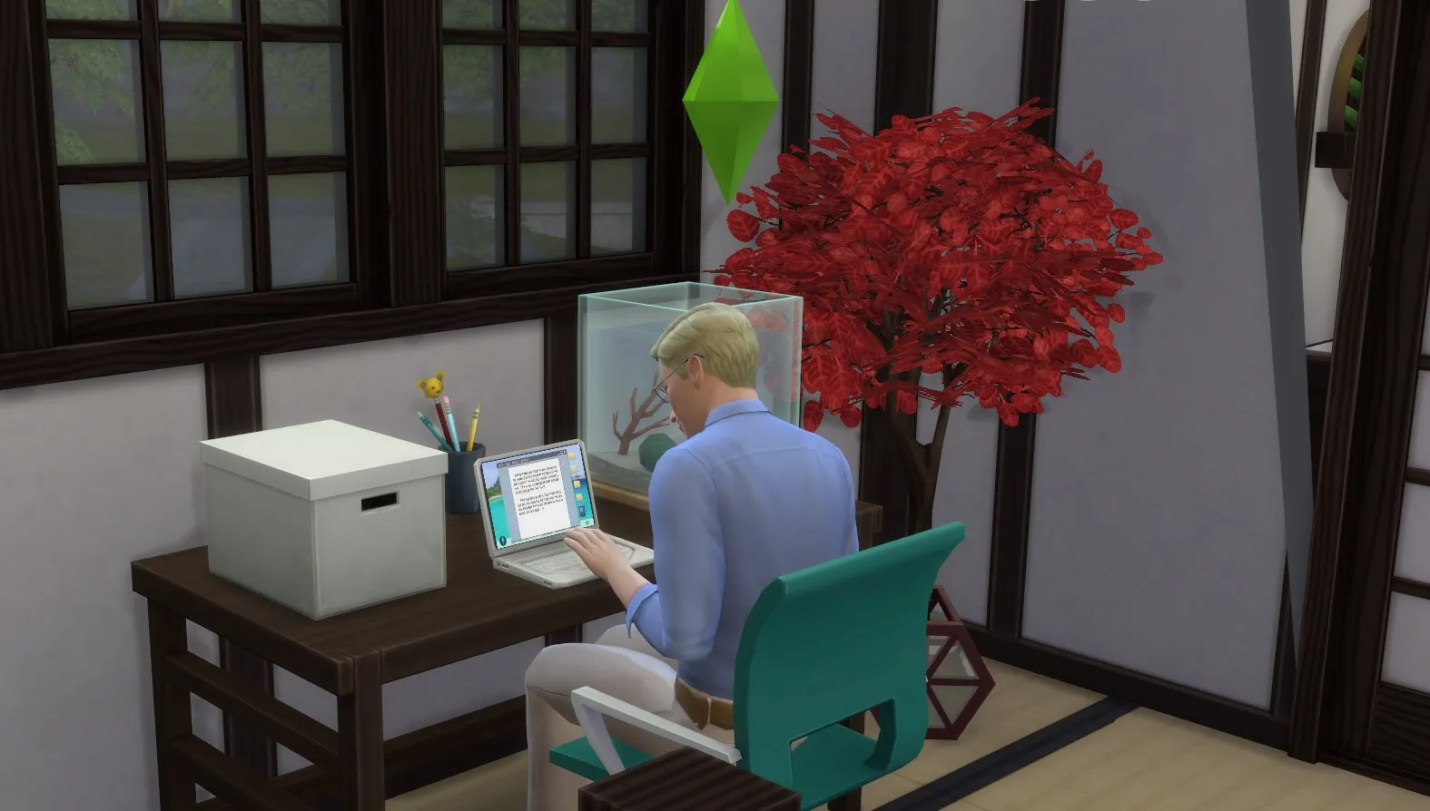 The Sims 4: Un'immagine di un Sim al suo computer portatile