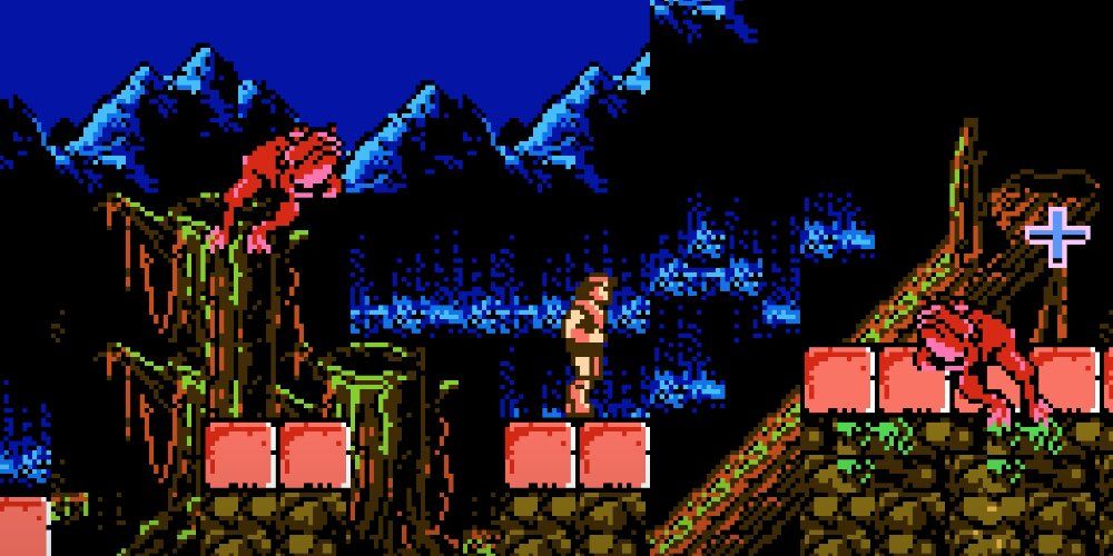 Персонаж окружен двумя прыгающими лягушками, стоя на платформе