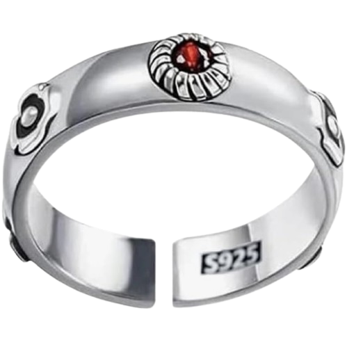 Un anello di metallo con una gemma rossa al centro