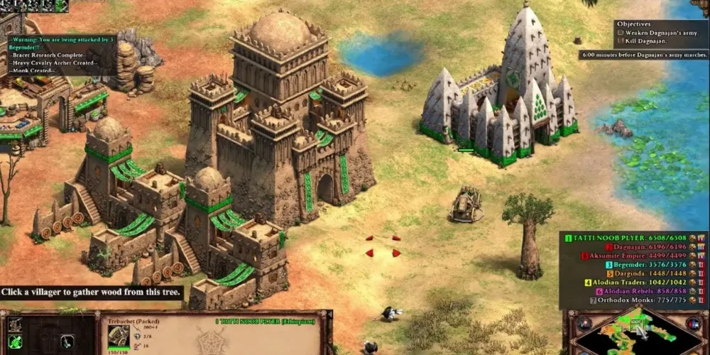 Two large buildings in the desert in Age Of Empires 2