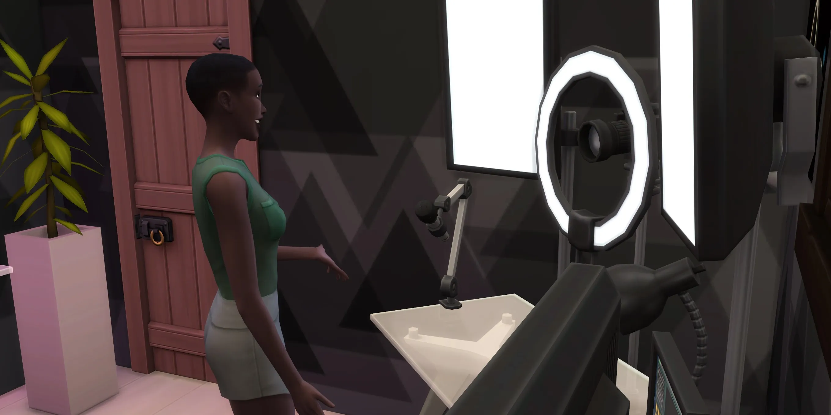 The Sims 4: Un Sim che registra un vlog allegra alla stazione video
