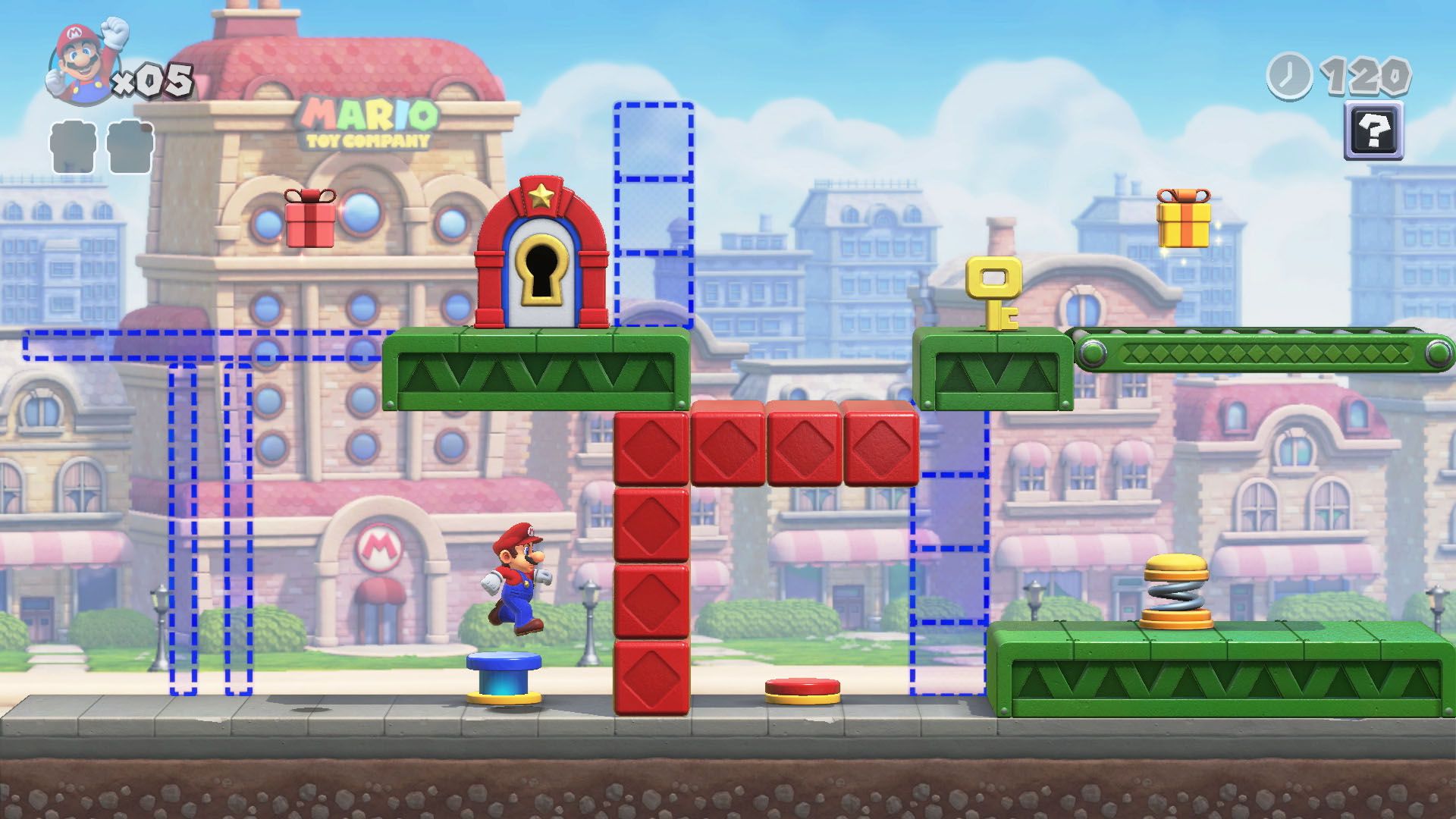 Mario salta su un interruttore blu, circondato da piattaforme rosse e verdi e contorni di quelli blu