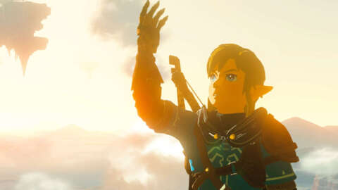 Link raises his arm toward the sky in Tears of the Kingdom.