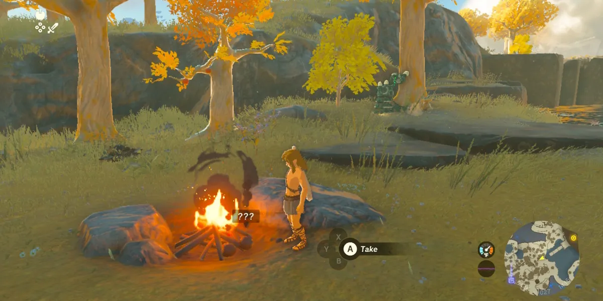 Link cooks food on a campfire in Tears of the Kingdom