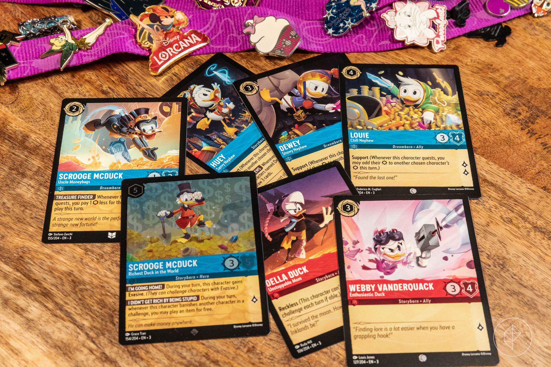 Scrooge McDuck, Huey, Dewey, Louie, Della, and Webby cards from Disney Lorcana’s Into the Inklands set.