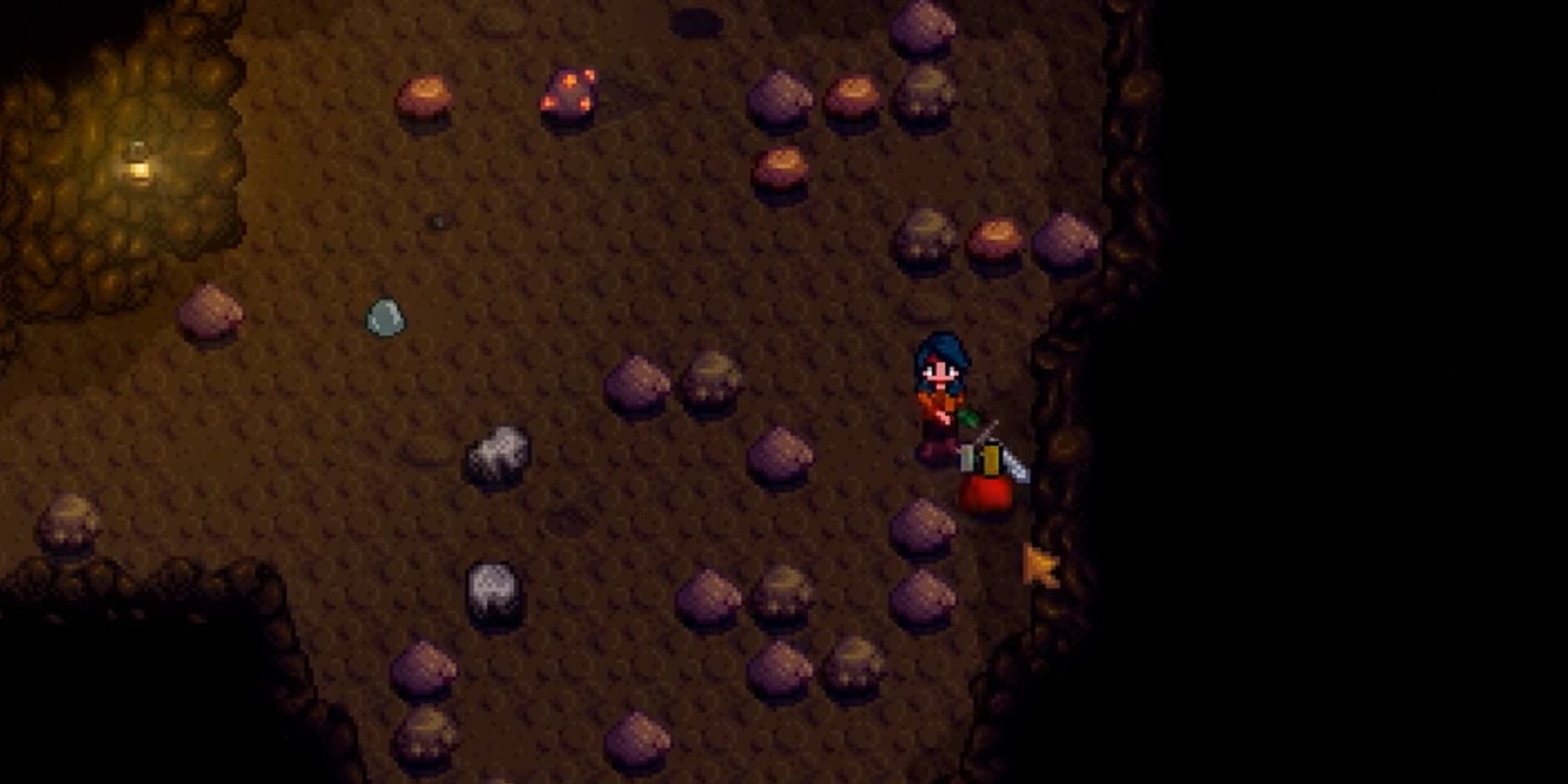 광산에서 검으로 슬라임을 공격하는 플레이어