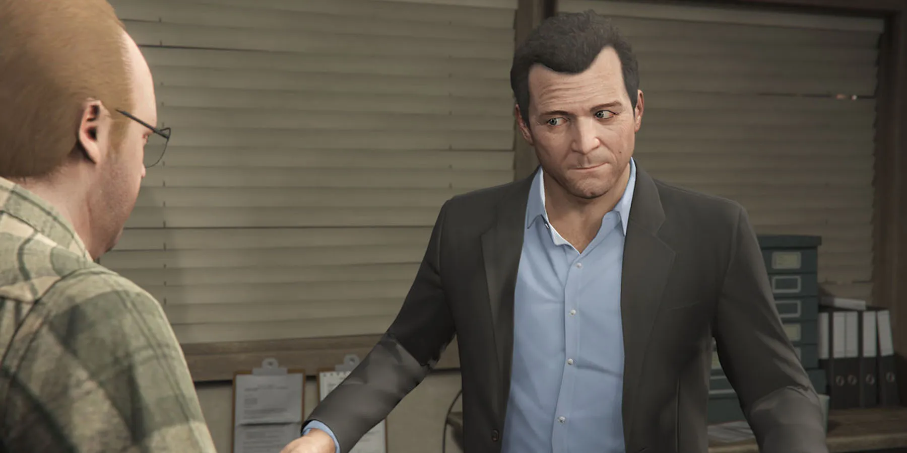 A screenshot of Michael planning a heist with Lester in Grand Theft Auto 5