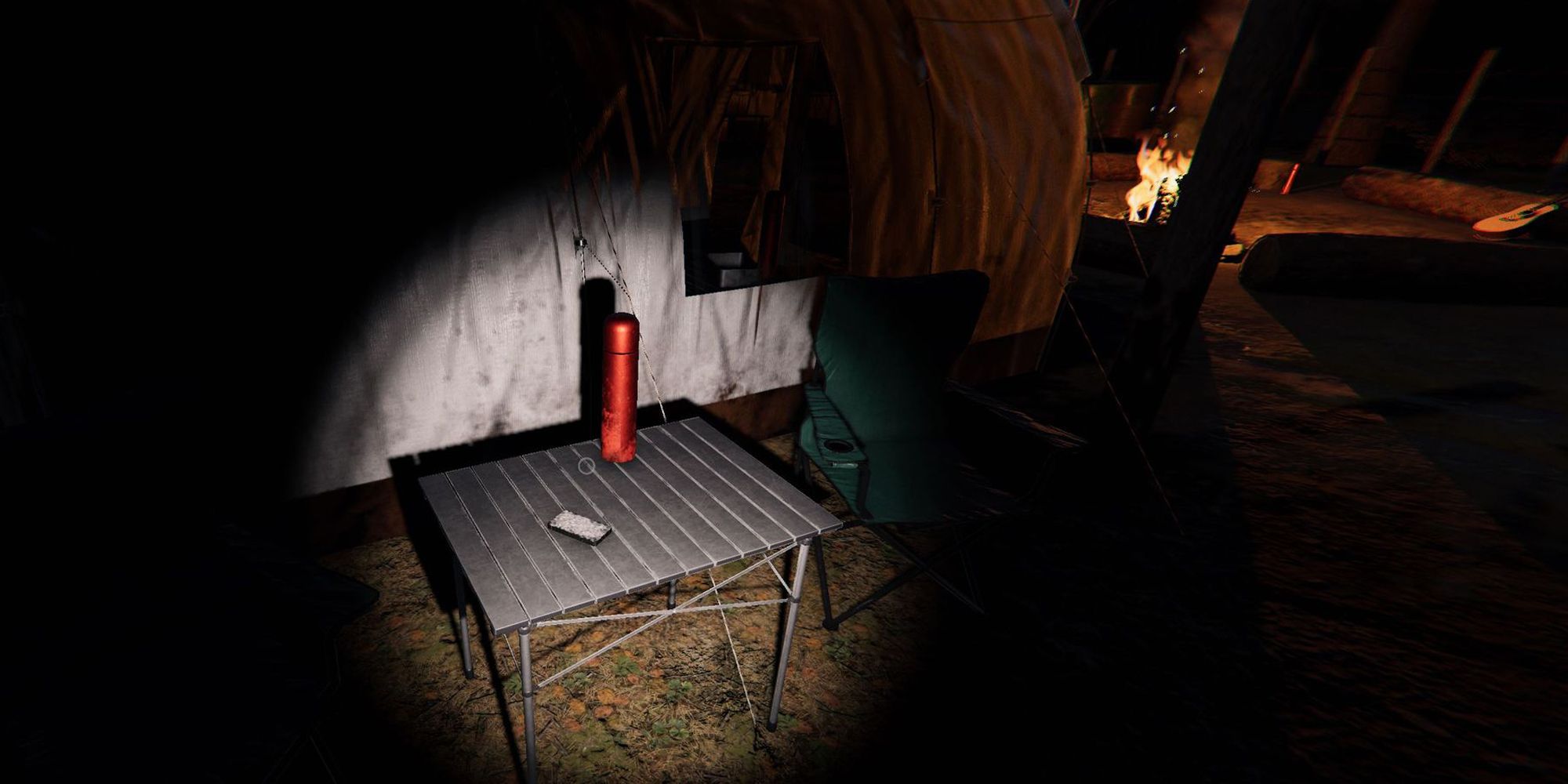 Image depicts a pack of tarot cards on a small camping table next to a red flask in Maple Lodge Campsite in Phasmophobia.