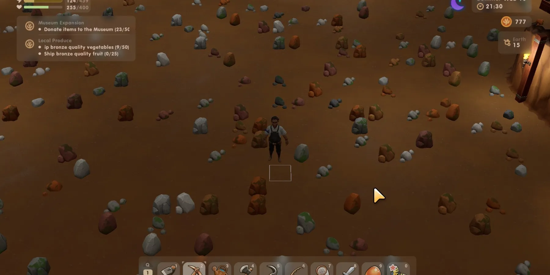 El jugador parado en las minas rodeado de rocas en Coral Island
