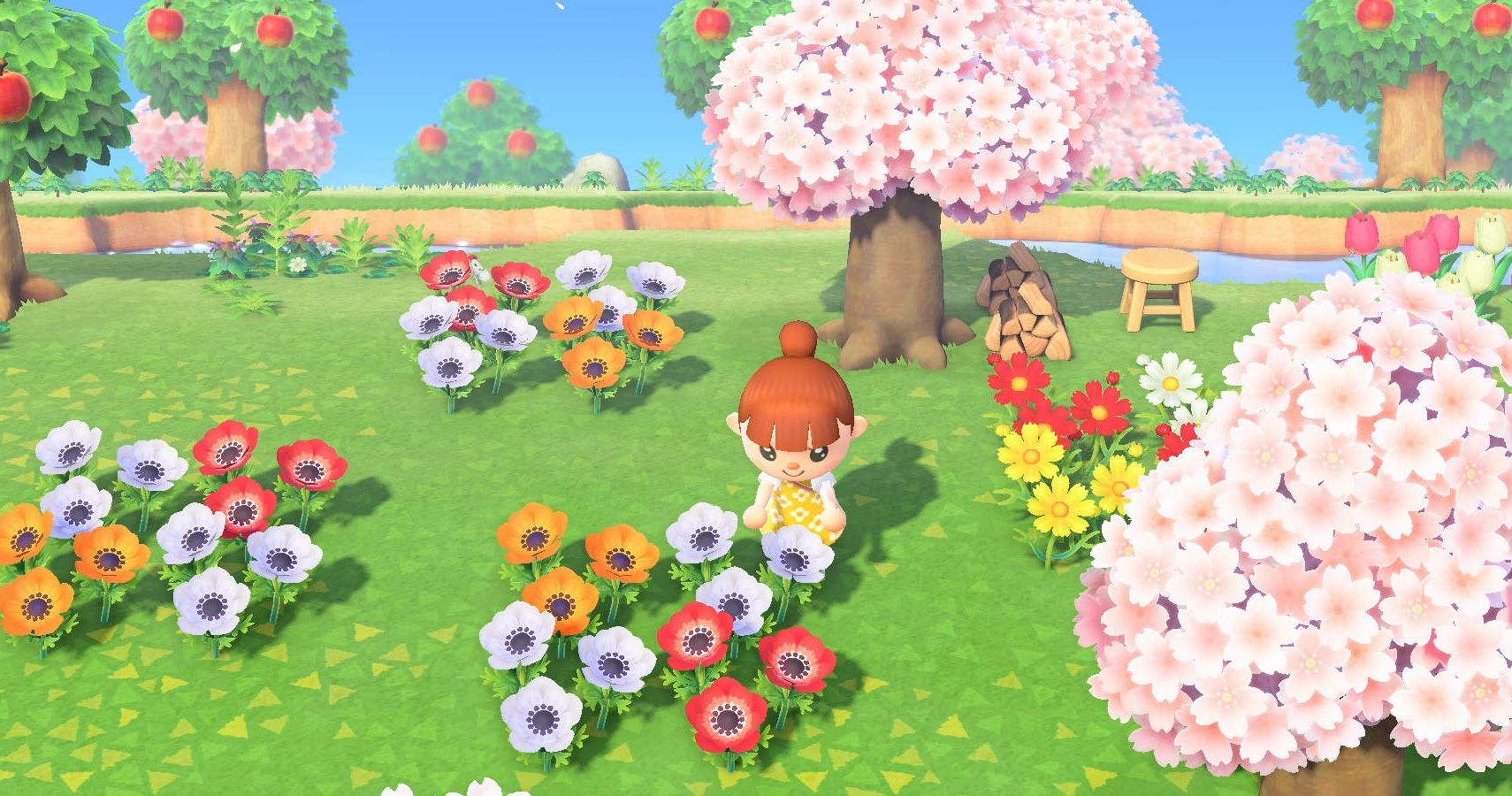Animal Crossing: New Horizons의 주인공이 꽃 주변에서 머물러 있습니다.