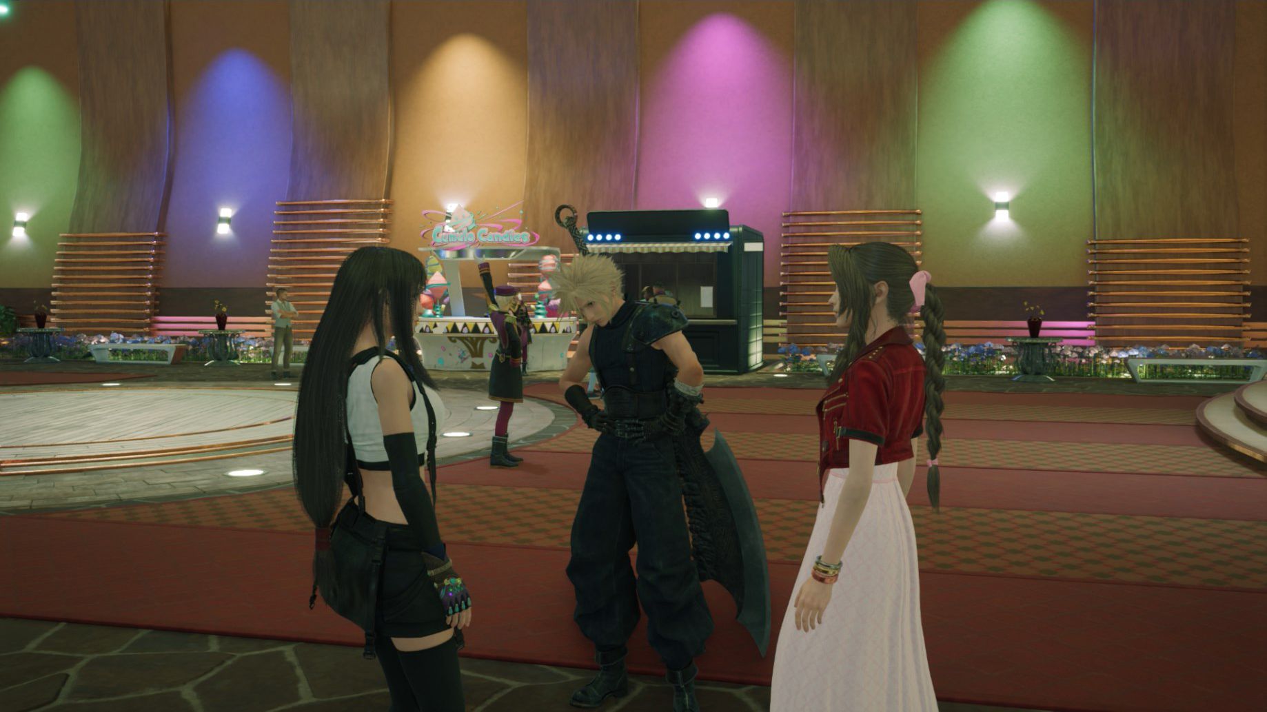 Cloud stands between Aerith and Tifa at the Gold Saucer in Final Fantasy 7 Rebirth