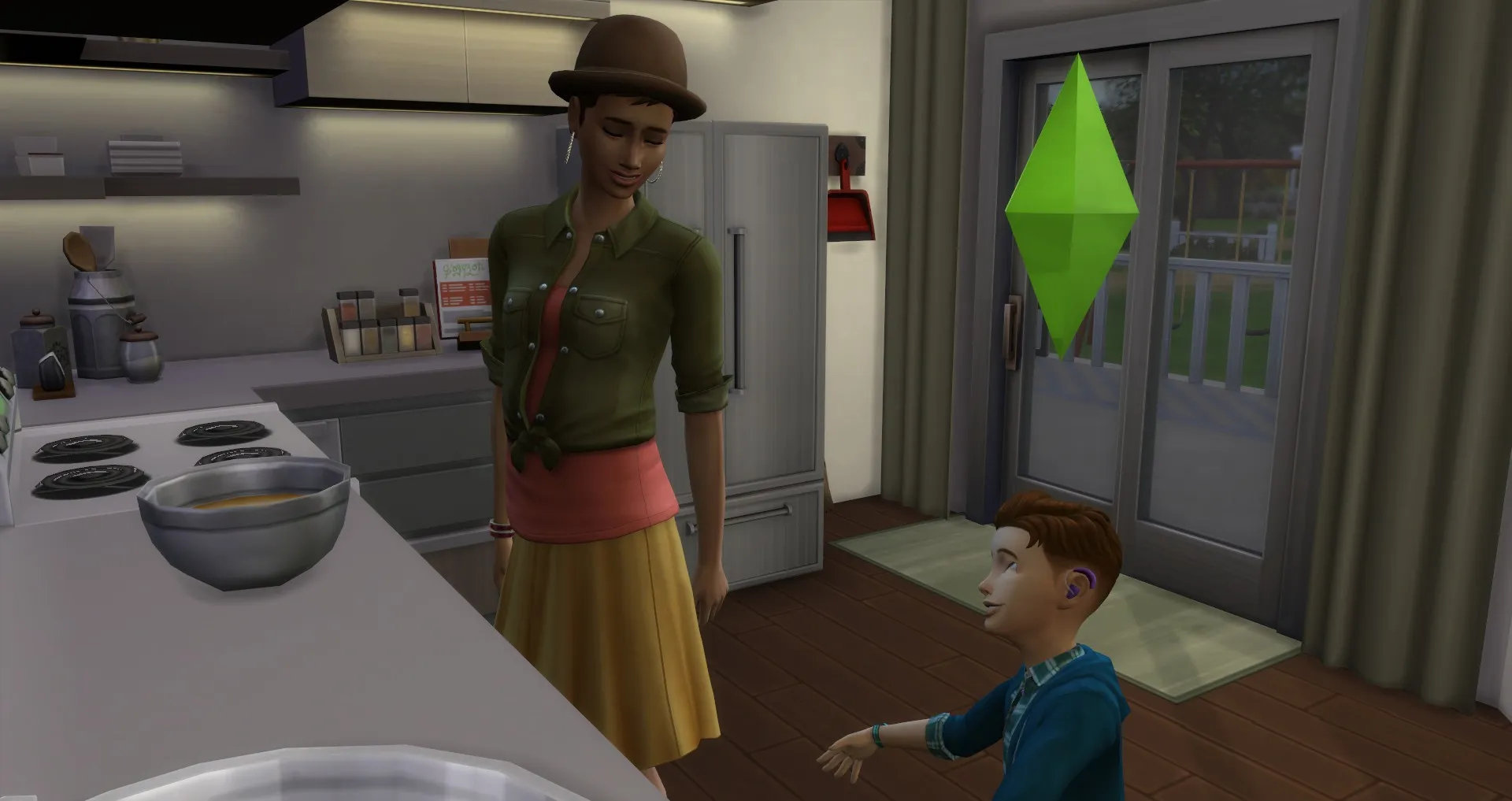 un enfant sim parlant à ses parents tandis qu'ils cuisinent ensemble dans la cuisine the sims 4 compétence sociale enfants