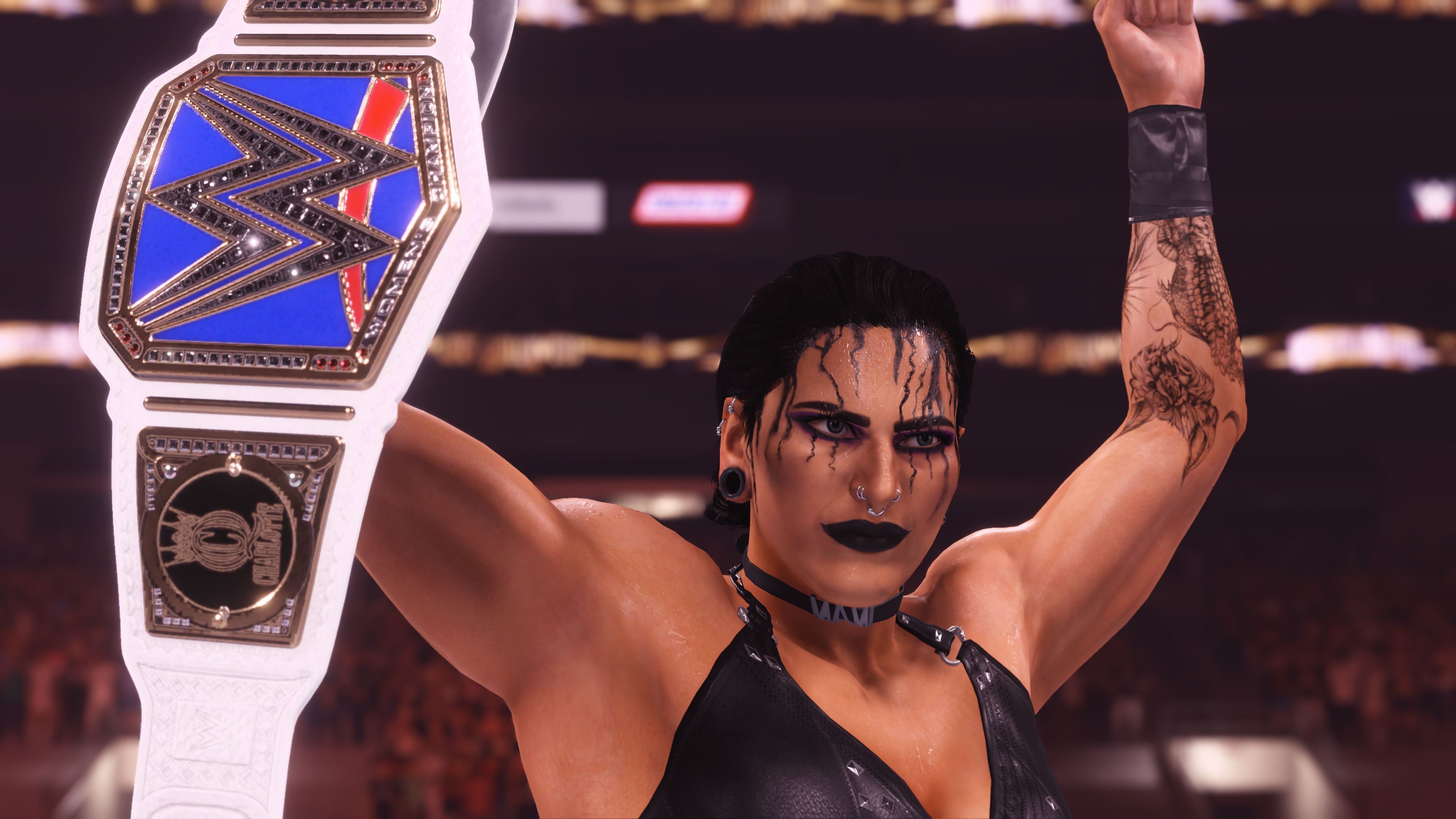 Rhea Ripley holds up the Smackdown Women’s Championship belt