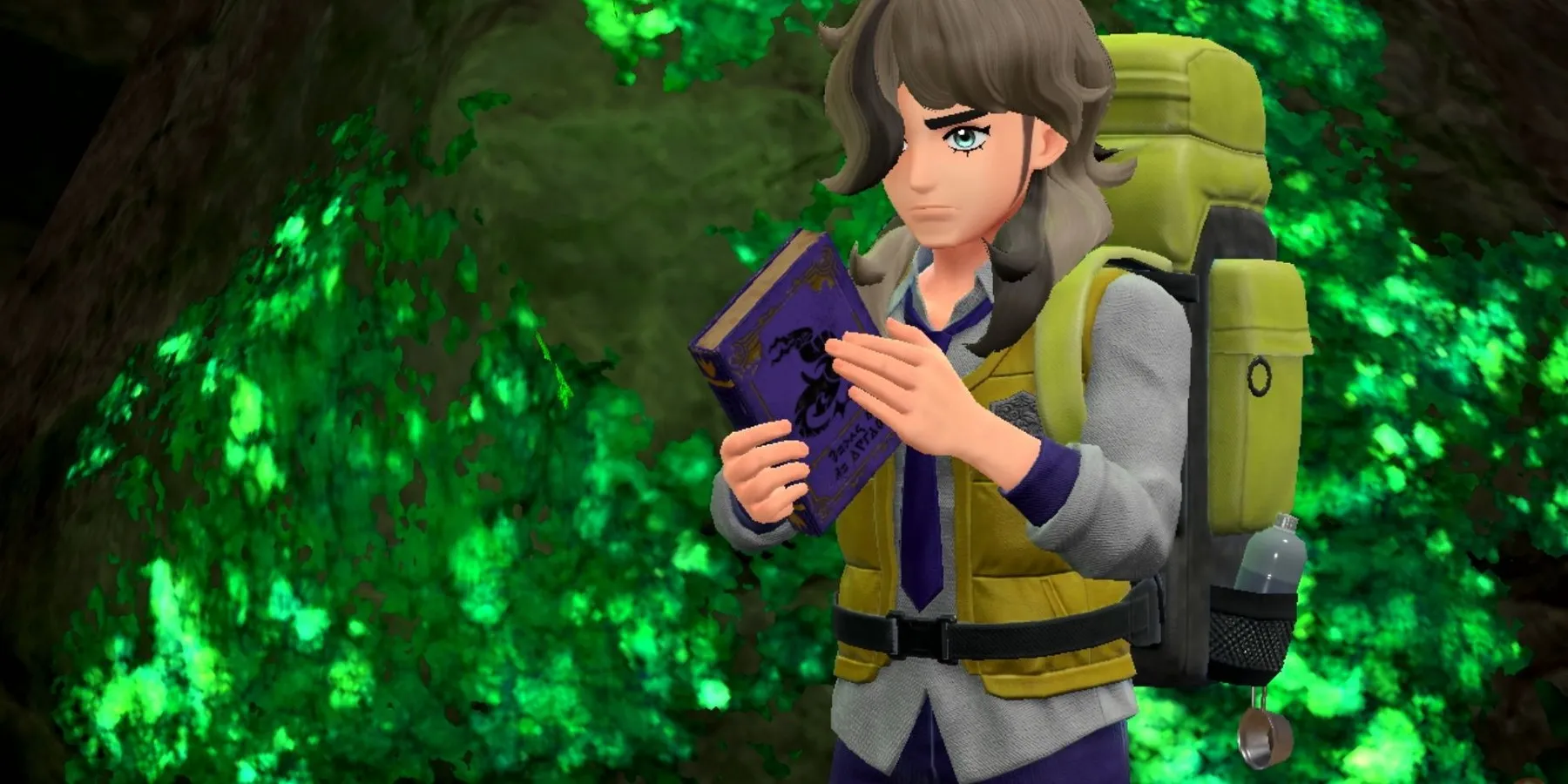 Arven sosteniendo un libro sobre Herba Mystica en Pokemon Scarlet & Violet.