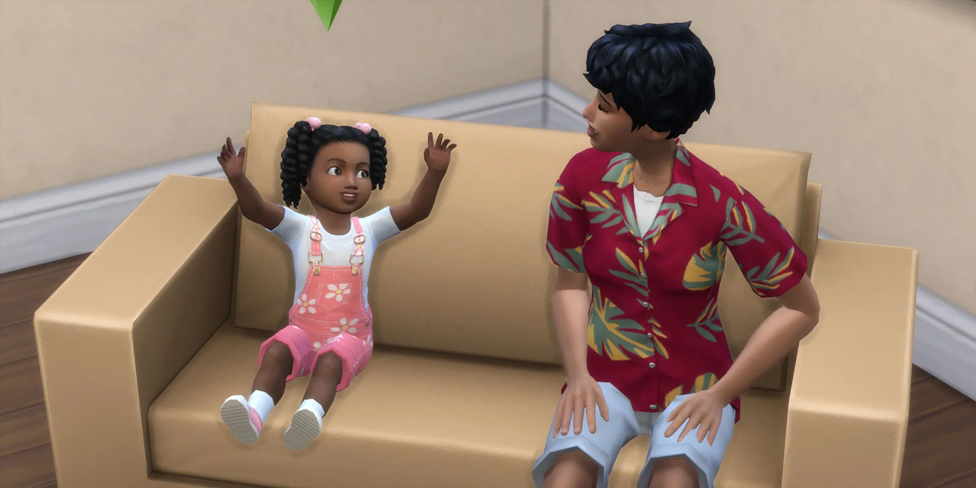 A Toddler Sim talking to her mom while both sit on the couch in The Sims 4.