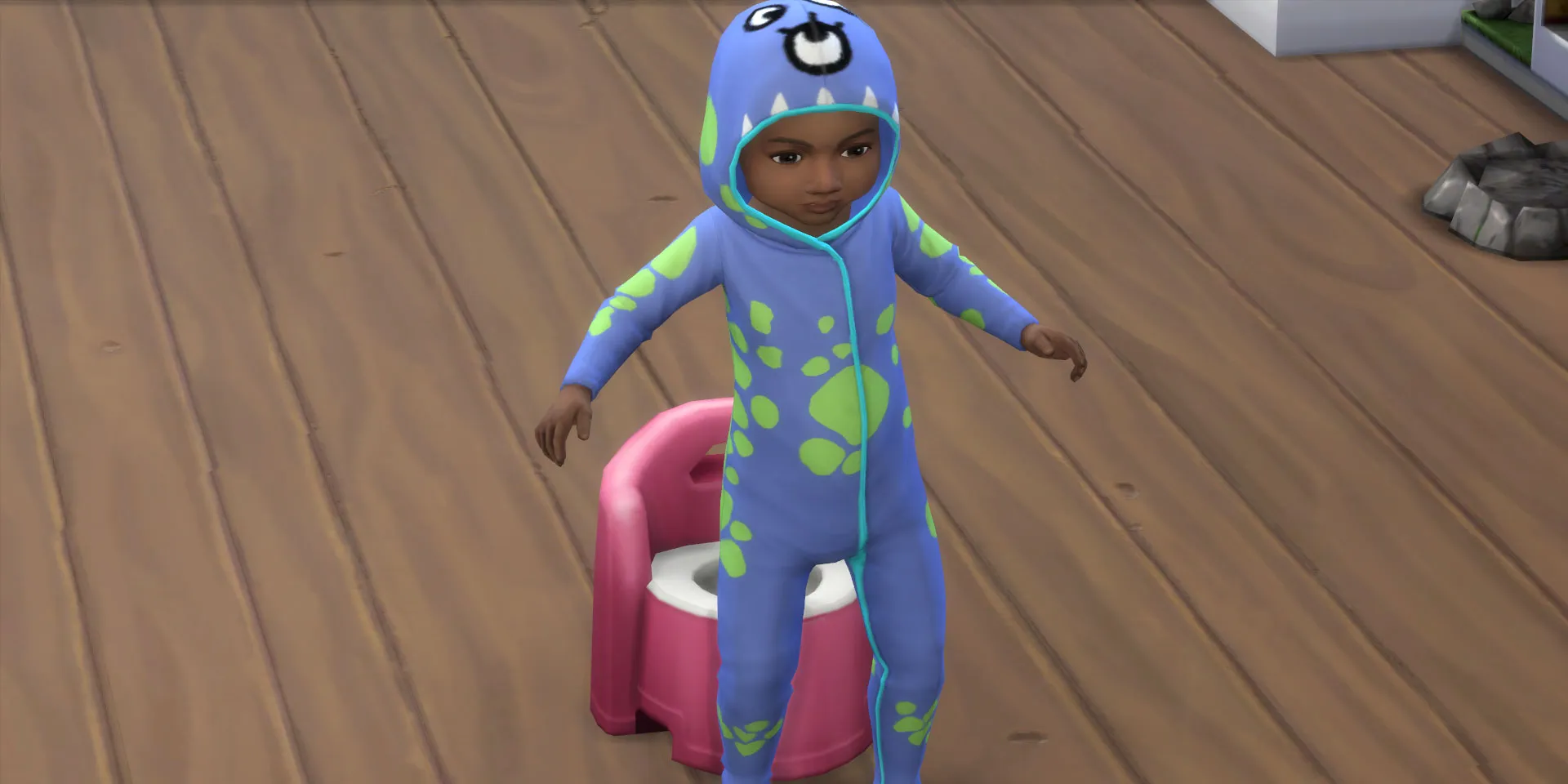 Un bebé a punto de sentarse en la silla del baño en Los Sims 4.