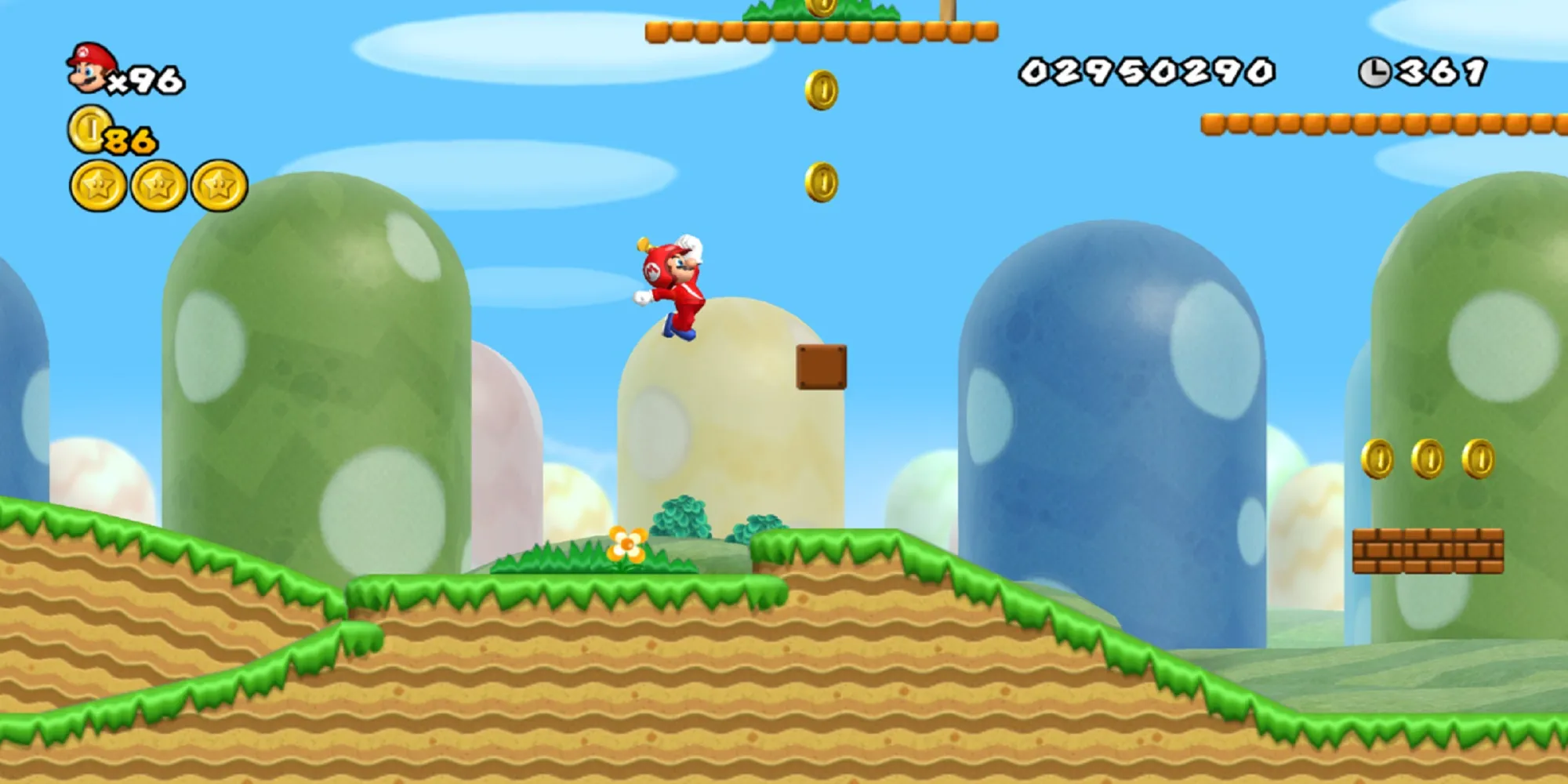 Mario con propulsore salta verso alcune monete