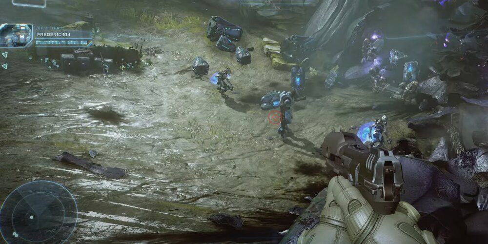 Player aiming a magnum at a group of Covenant