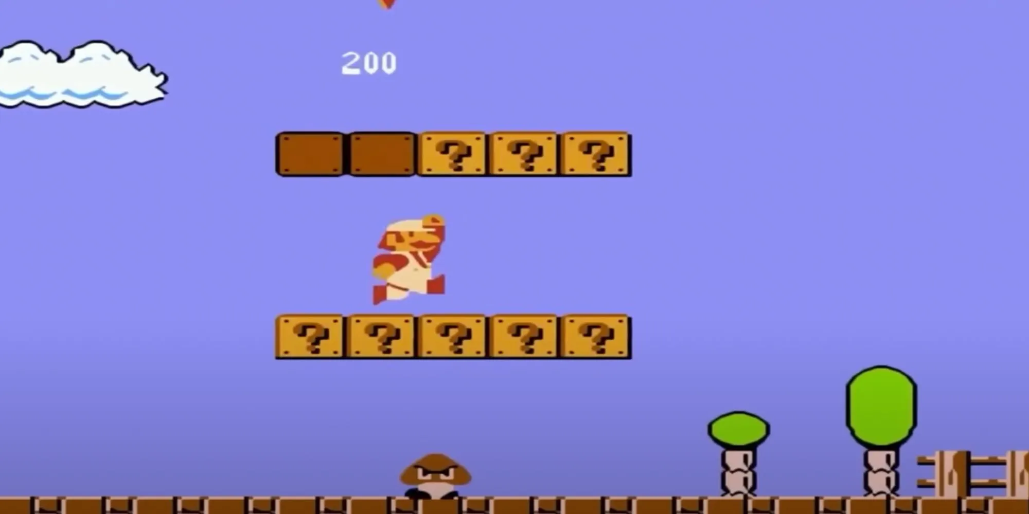 Mario jumping up in a level from the original 1985 Super Mario Bros.