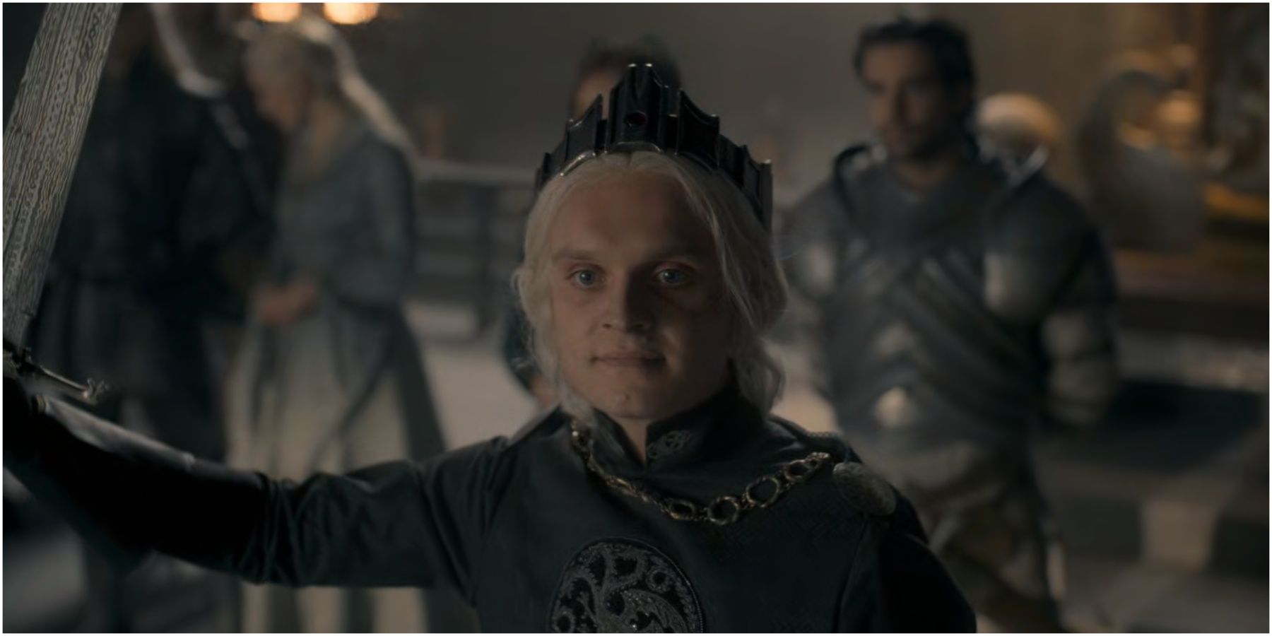 Aegon II Targaryen holds Blackfyre and wears the Conqueror’s crown in House of the Dragon