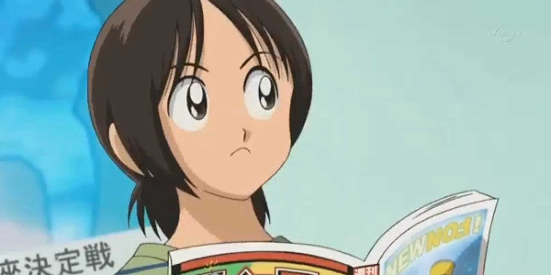 Aoba Tsukishima en train de lire un manga
