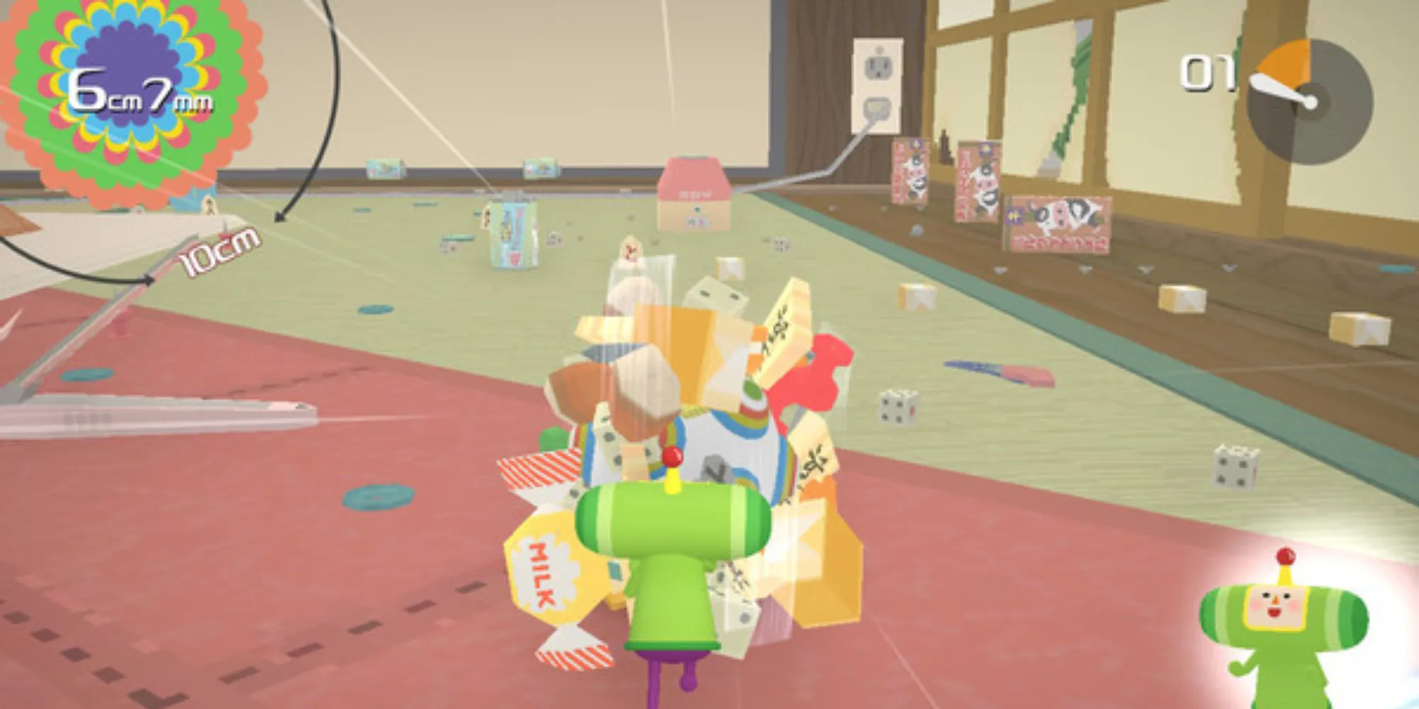 Una captura de pantalla que muestra el gameplay de Katamari Damacy REROLL