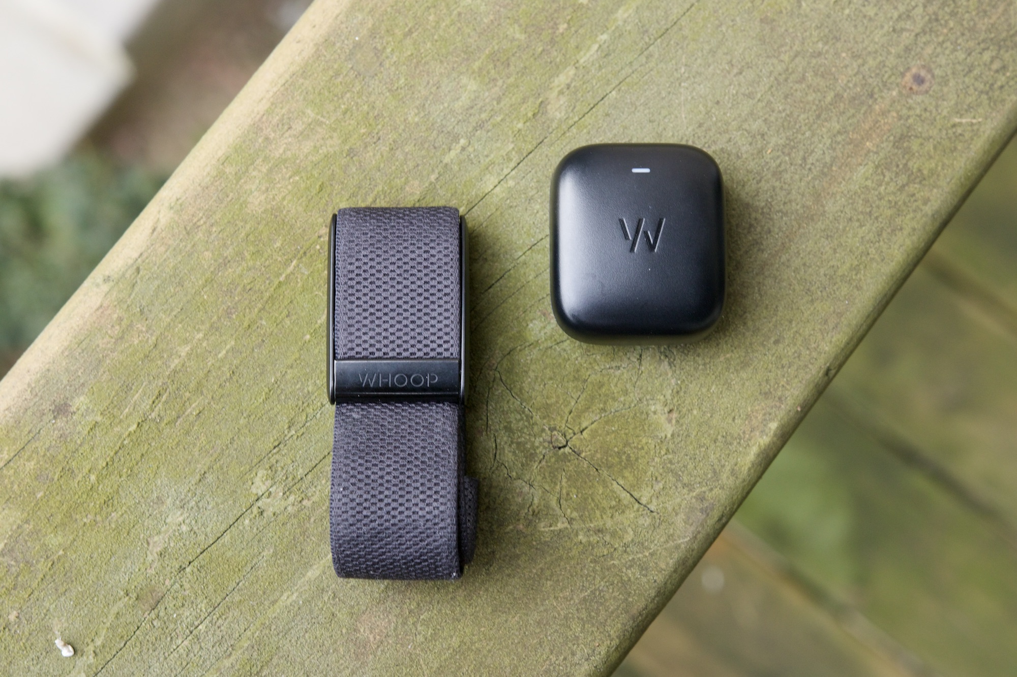 The Whoop 4.0 next to its Battery Pack accessory.