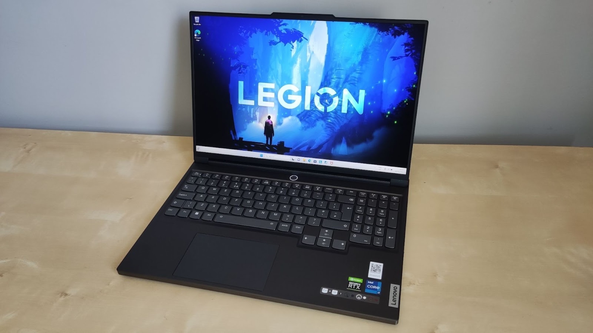 Lenovo Legion gaming laptop on desk with “LEGION” on screen