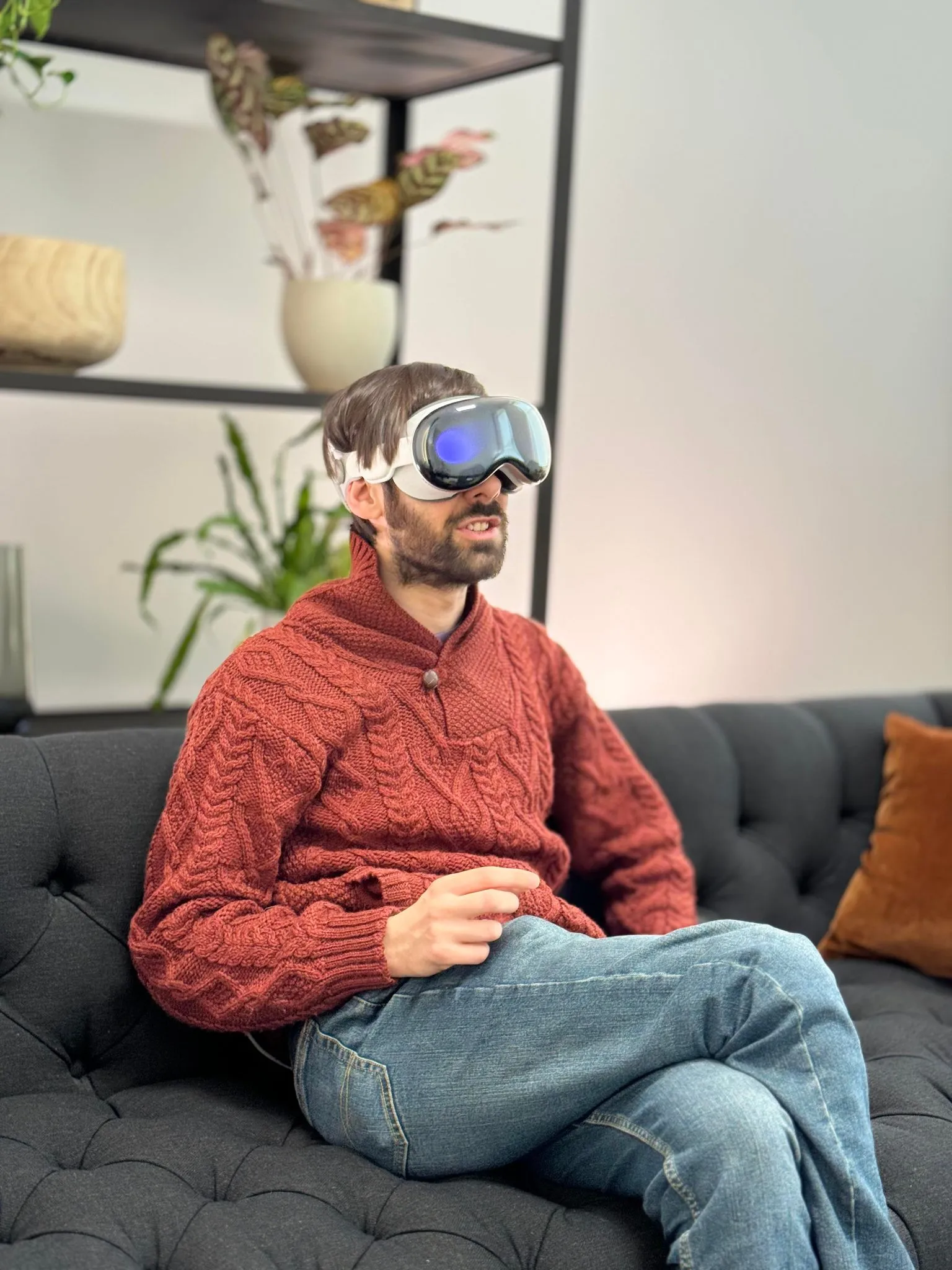 A man controls the Apple Vision Pro with pinch gestures.