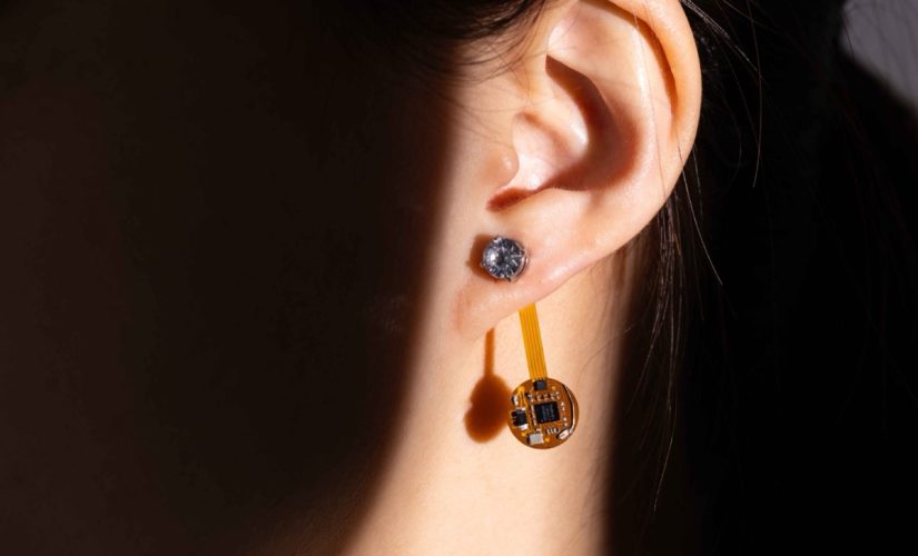 A person wearing the Thermal Earring