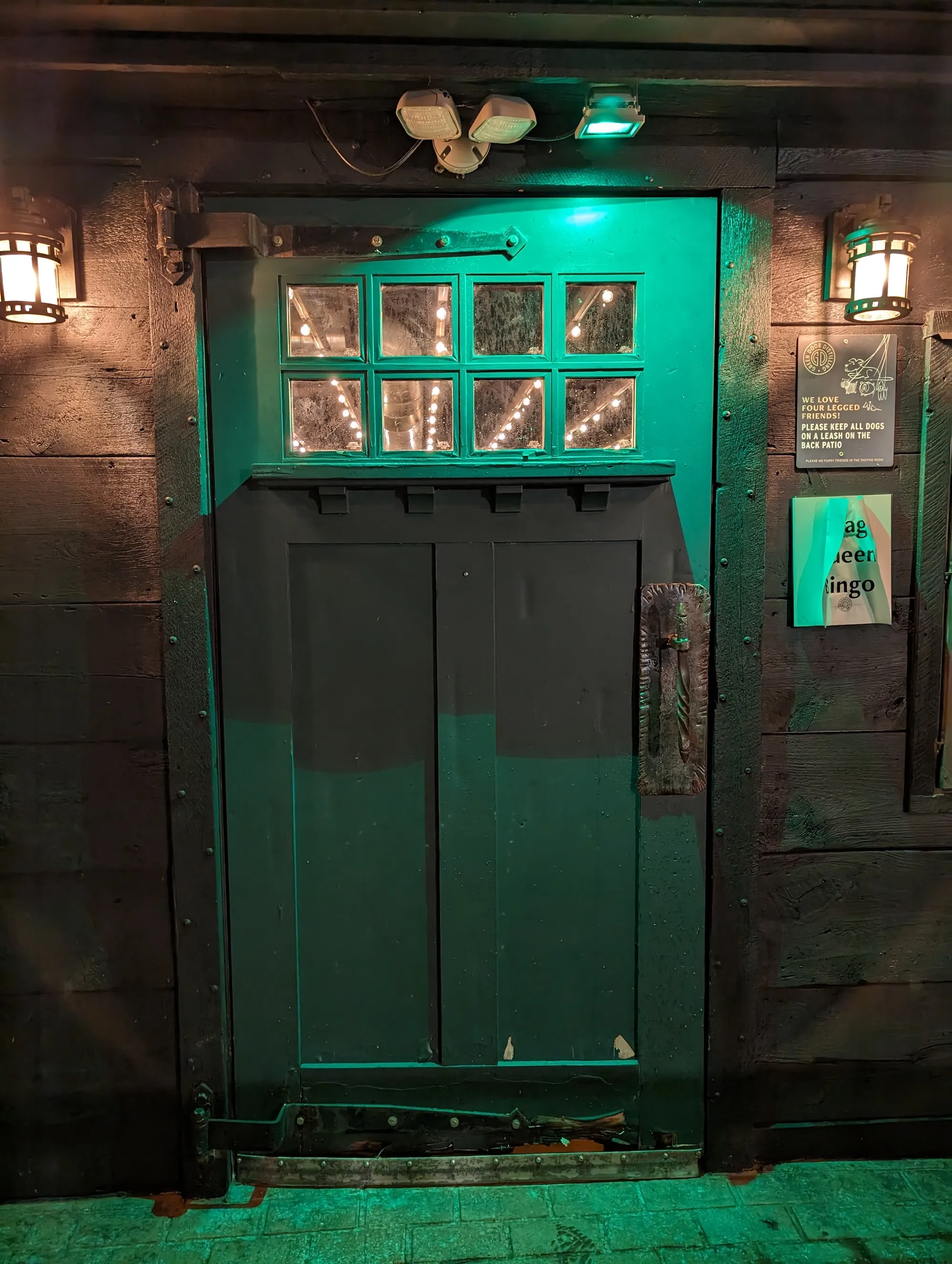Photo of a green door late at night, taken with the Google Pixel 8 Pro.