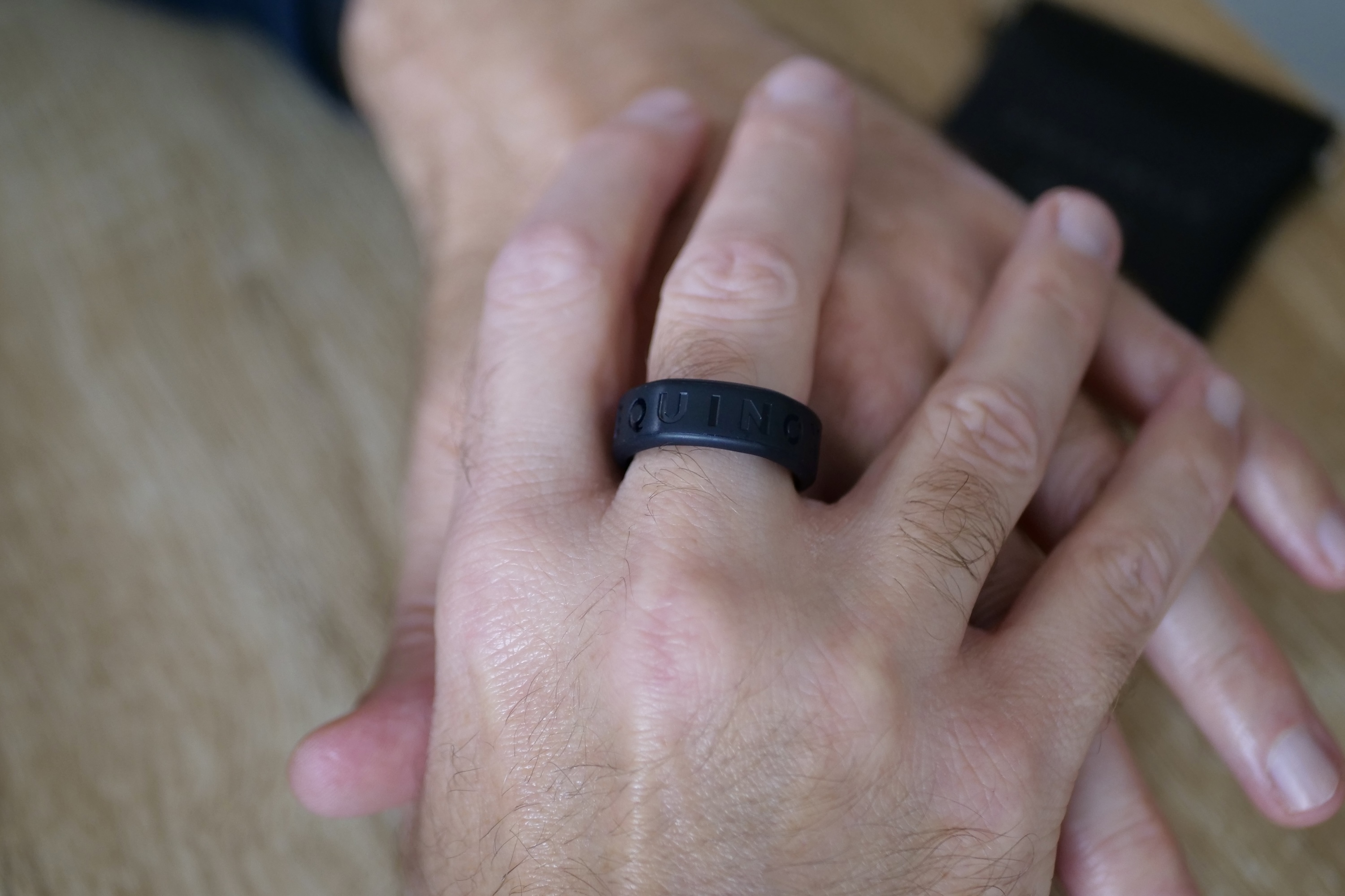 A person wearing the Oura Ring in the Equinox Ring Cover