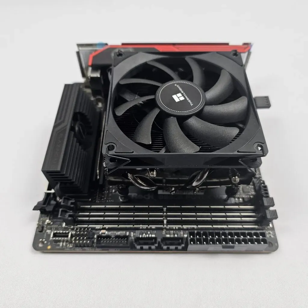 A mini-ITX motherboard with the Thermalright AXP90-X47 low profile CPU cooler