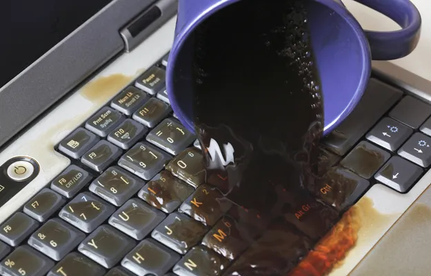 Spilled liquid on laptop keyboard.