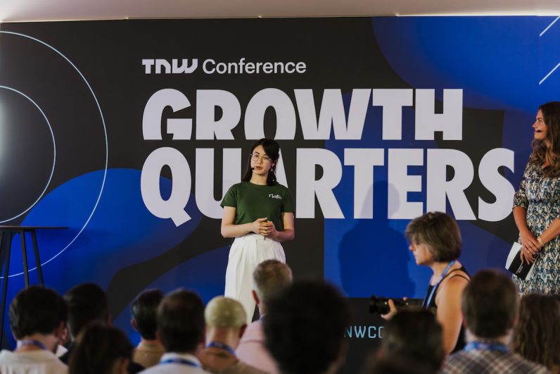 Isabell Trinh, Communications Specialist at Nostics, on stage at TNW’s Pitch Battle Competition