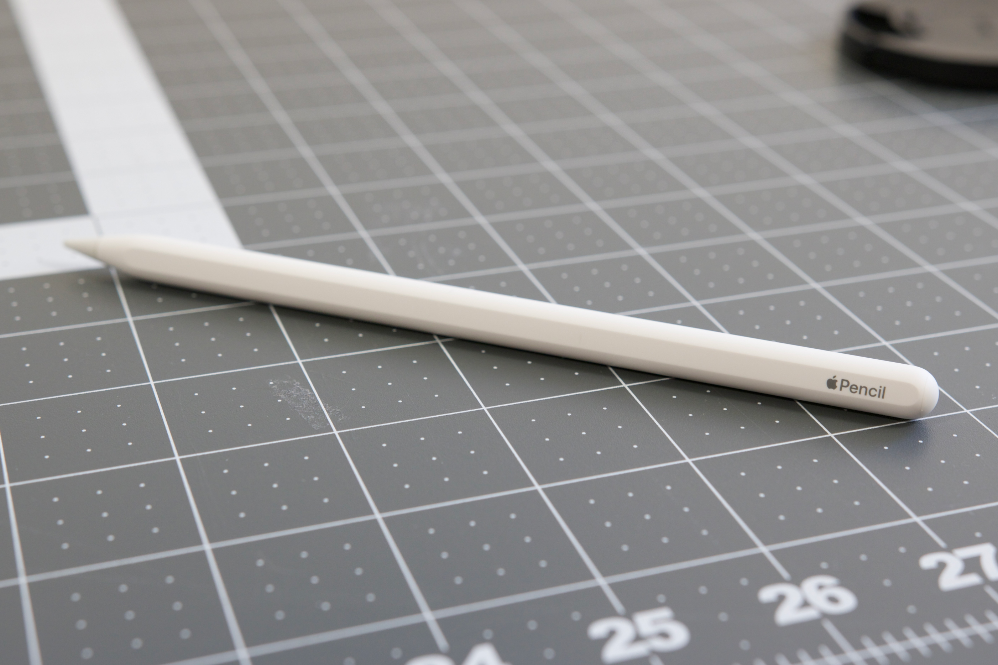The 2nd gen Apple Pencil laying on a table