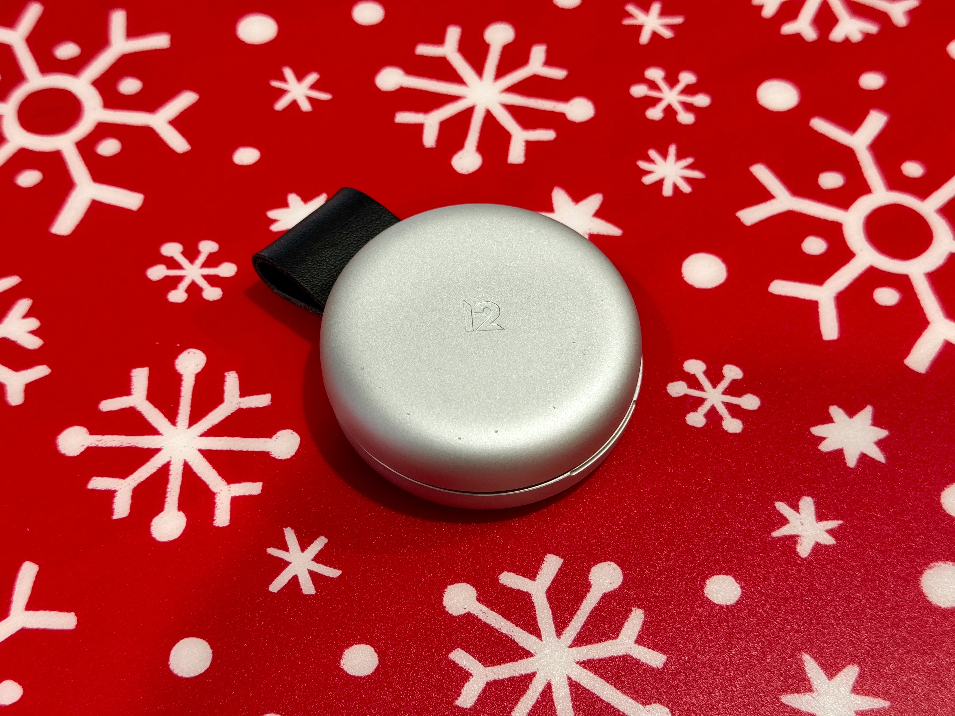 Twelve South ButterFly 2-in-1 MagSafe Charger closed on a festive placement